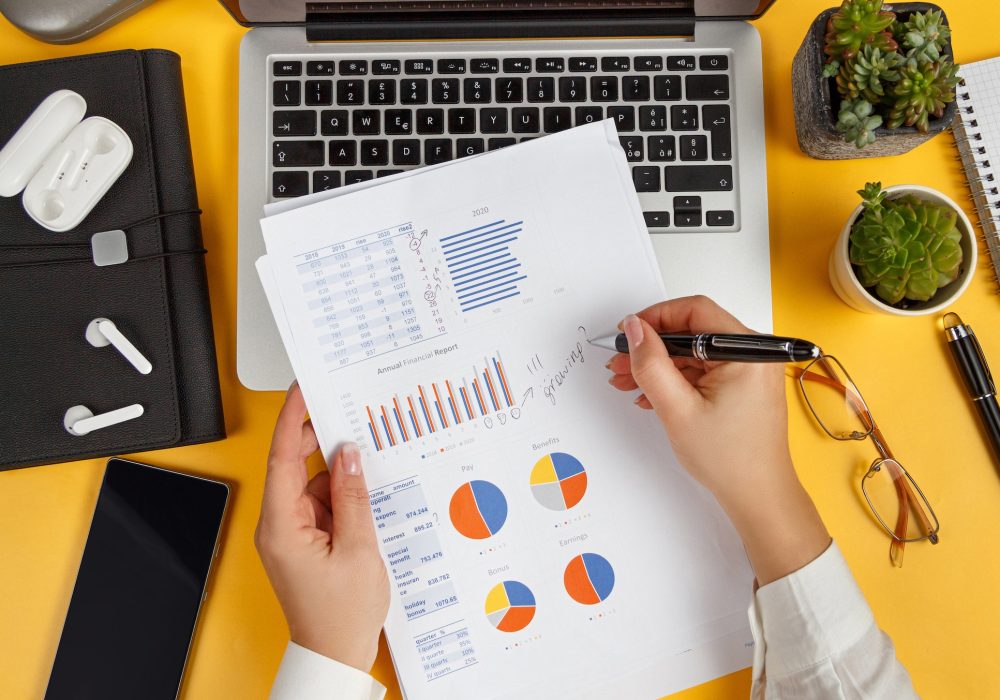 Business woman hands writing on report top view