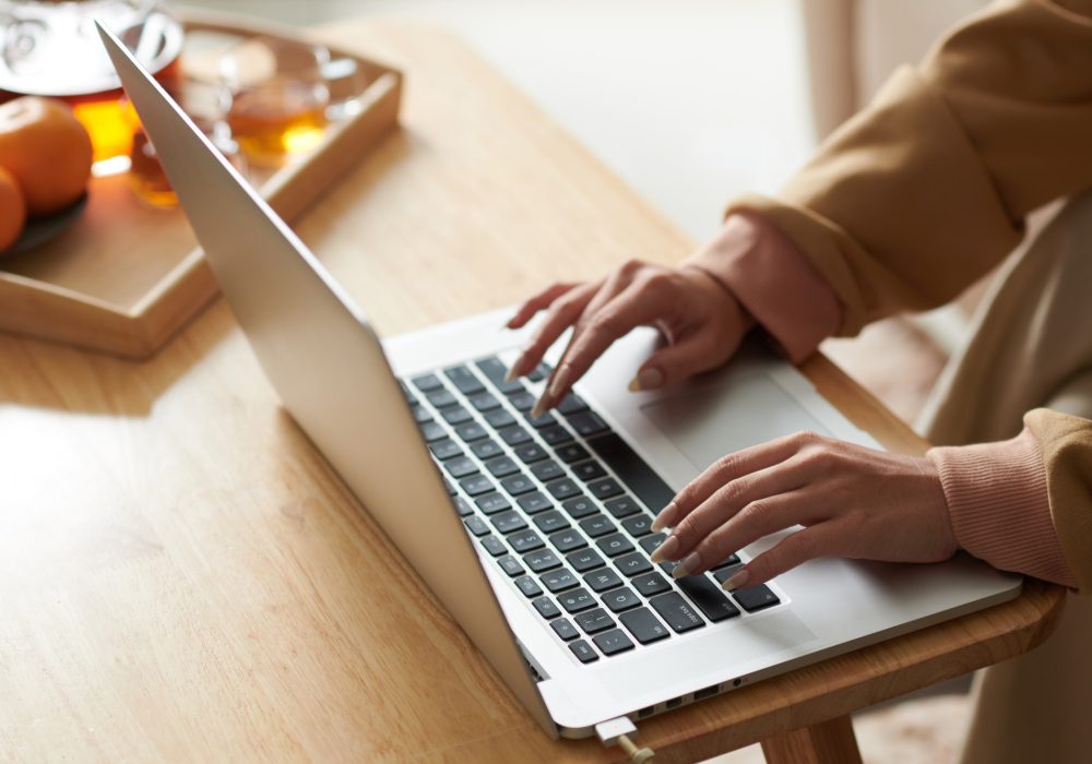 Woman working on laptop online
